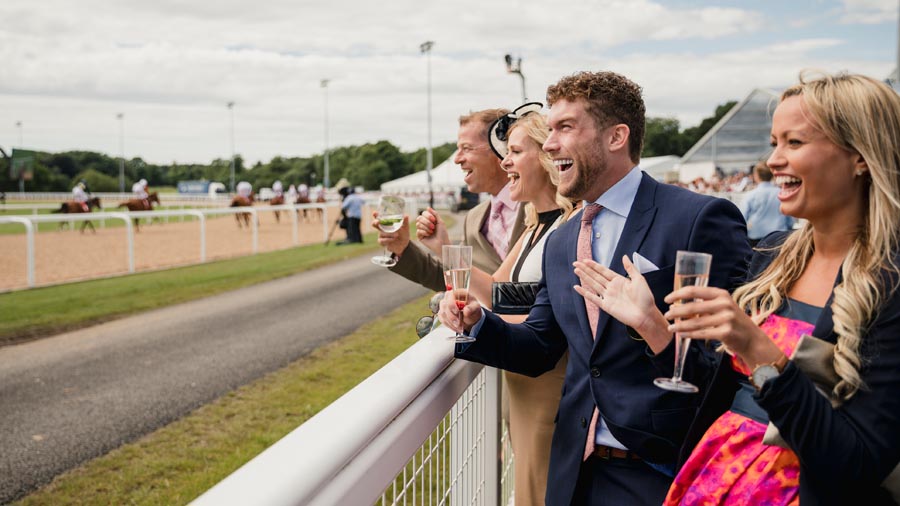 people enjoying horse race